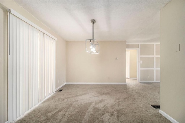 unfurnished dining area featuring carpet