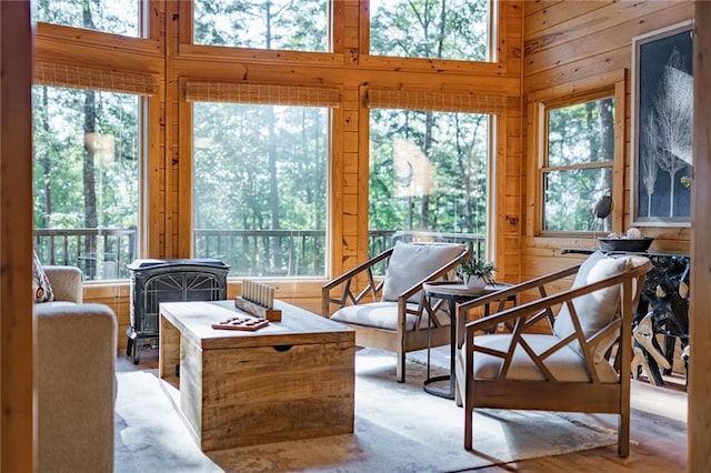 sunroom / solarium with a wood stove