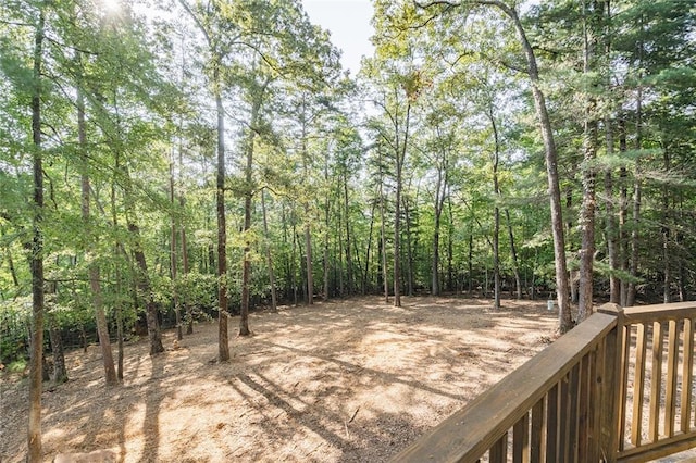 wooden deck featuring a wooded view