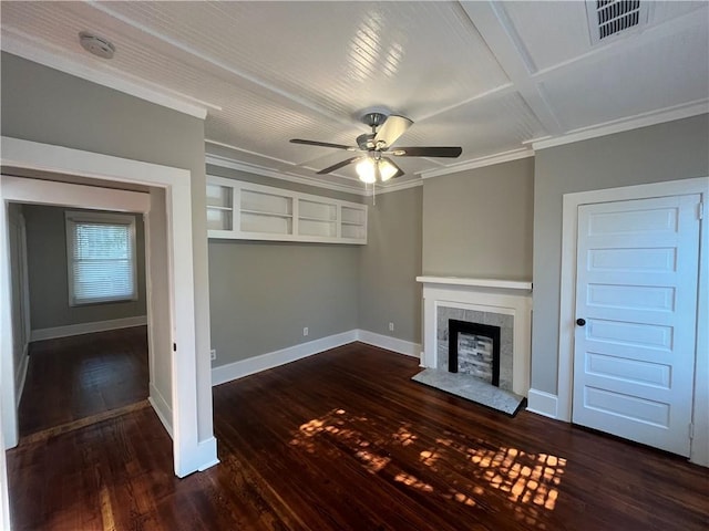 unfurnished living room featuring ceiling fan, dark wood-style flooring, a fireplace, baseboards, and ornamental molding