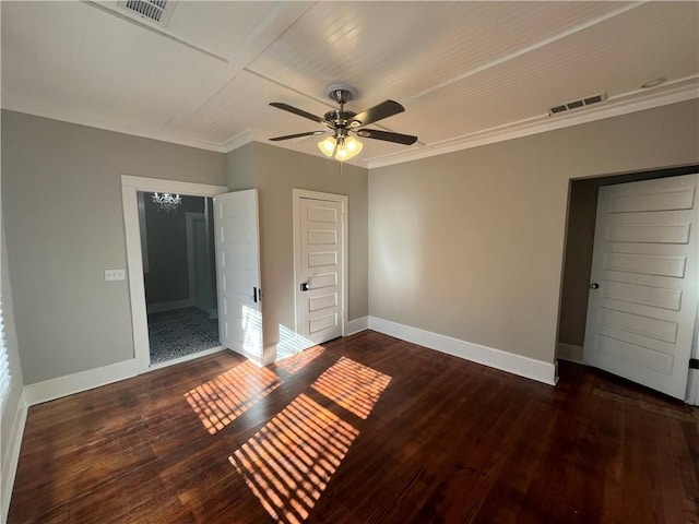 unfurnished bedroom featuring ornamental molding, hardwood / wood-style floors, visible vents, and baseboards