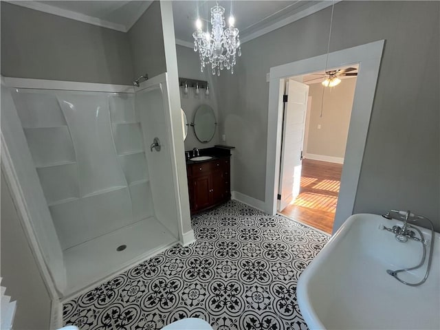 full bathroom with vanity, baseboards, a freestanding bath, a shower, and ornamental molding