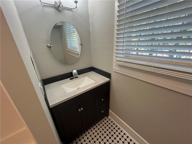 bathroom featuring vanity and baseboards