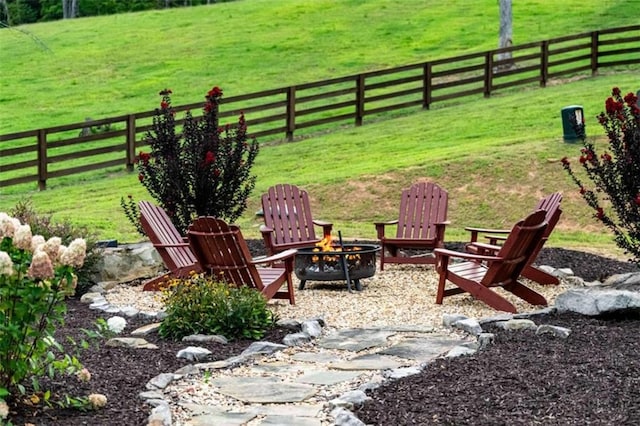 view of yard with a fire pit