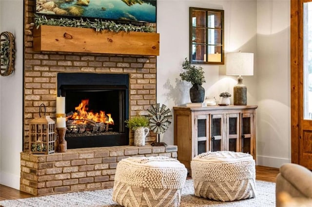 sitting room featuring hardwood / wood-style floors and a fireplace