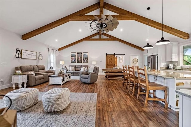 living room featuring beam ceiling, ceiling fan, a barn door, high vaulted ceiling, and dark wood-type flooring