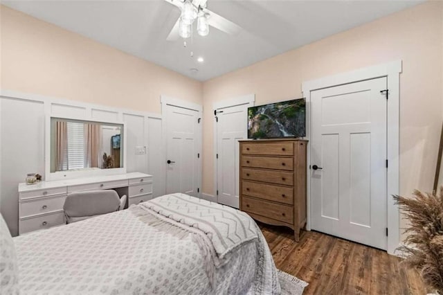 bedroom featuring dark hardwood / wood-style floors and ceiling fan