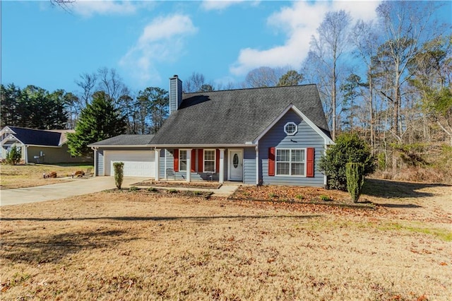 view of front of home featuring a garage and a front yard