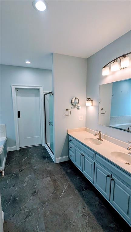 bathroom featuring vanity and shower with separate bathtub