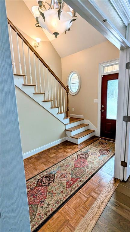 entryway featuring parquet floors