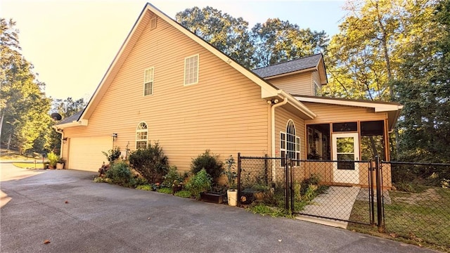 view of property exterior featuring a garage