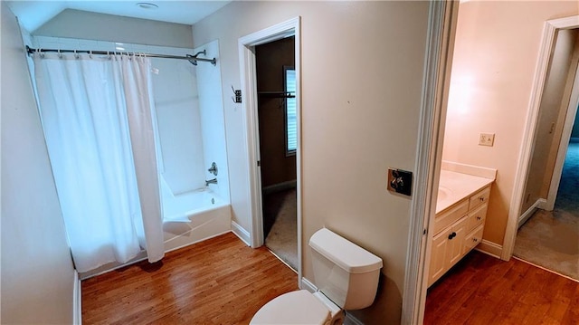 full bathroom with shower / bath combo with shower curtain, vanity, wood-type flooring, and toilet