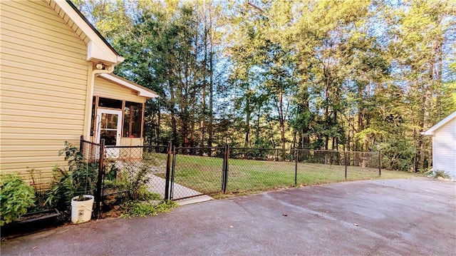 view of patio featuring a sunroom