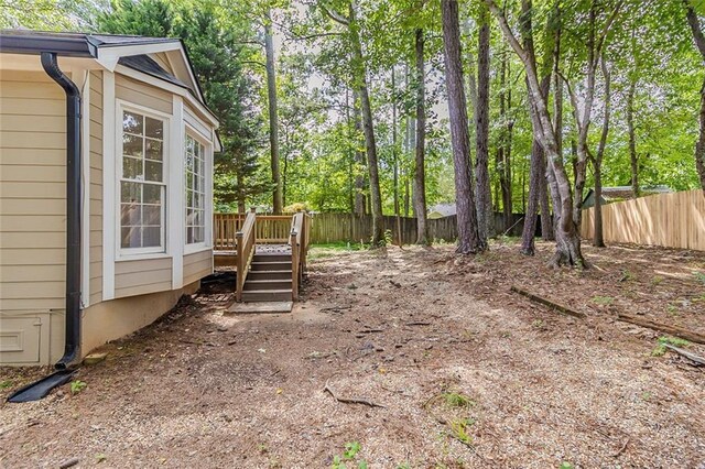 3614 Spring Leaf Ln, Acworth, GA 30101 - fenced backyard featuring a deck