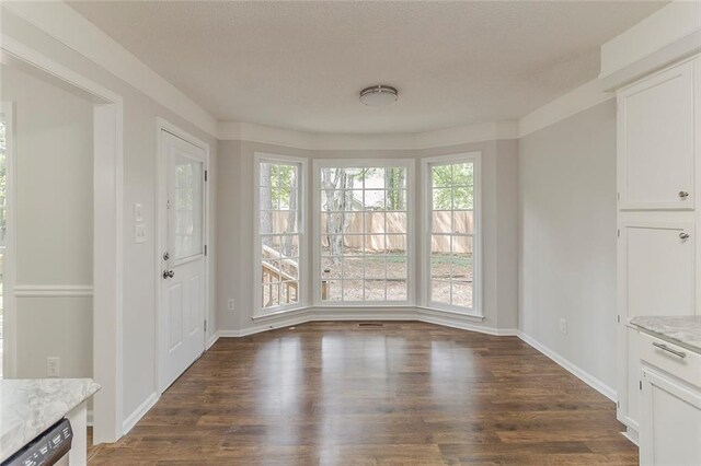 3614 Spring Leaf Ln, Acworth, GA 30101 - unfurnished dining area with dark wood finished floors and baseboards