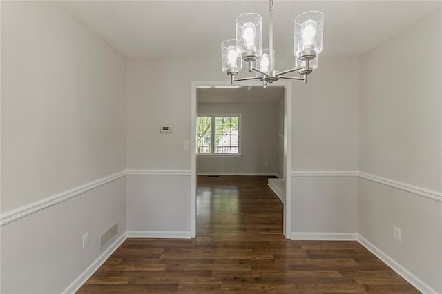 3614 Spring Leaf Ln, Acworth, GA 30101 - unfurnished dining area with a chandelier and dark wood-style flooring