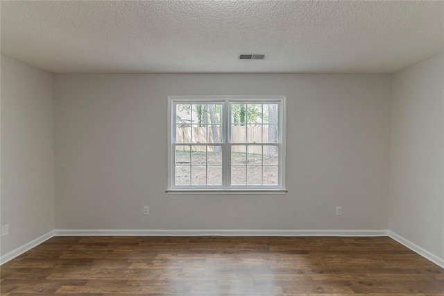 3614 Spring Leaf Ln, Acworth, GA 30101 - empty room featuring dark wood-style flooring and a textured ceiling