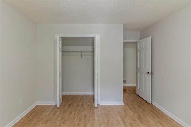 3614 Spring Leaf Ln, Acworth, GA 30101 - unfurnished bedroom featuring light wood-style flooring and a closet