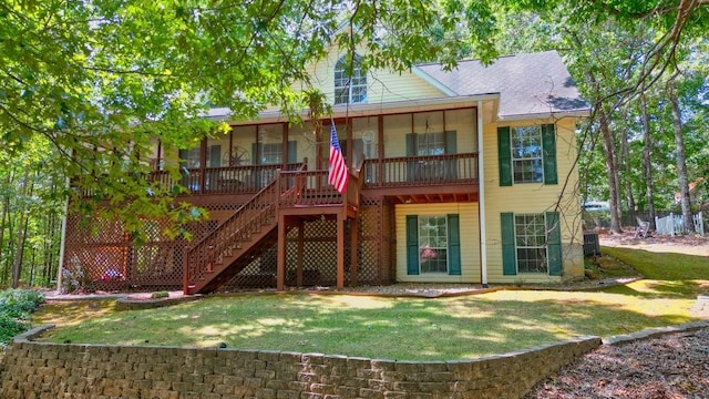 rear view of property featuring a yard