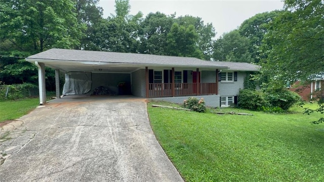 5924 Central Church Rd, Douglasville, GA 30135 - ranch-style home with a porch, concrete driveway, a front yard, and an attached carport