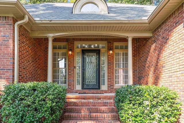 entrance to property featuring a porch