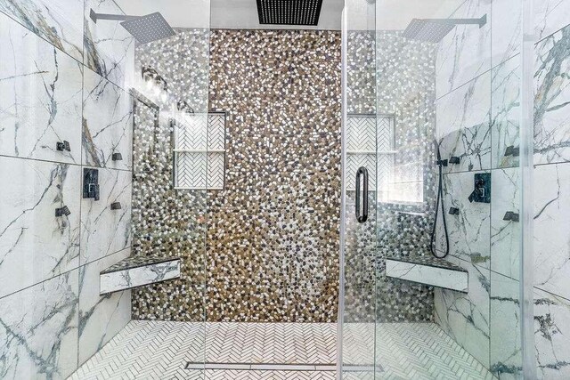 bathroom with a shower with shower door