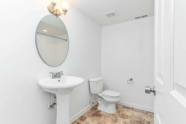 bathroom with toilet and sink