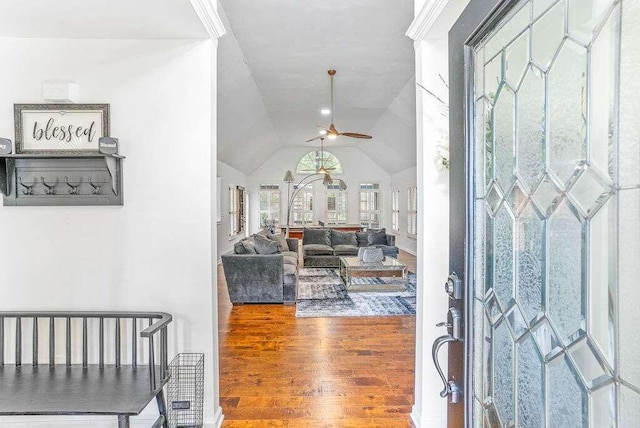 foyer entrance featuring ceiling fan, lofted ceiling, and hardwood / wood-style floors