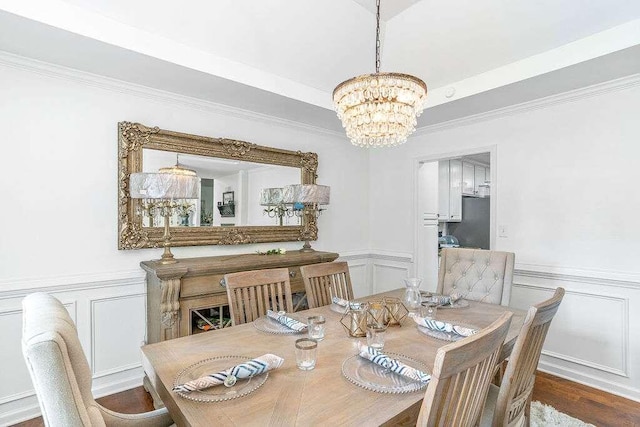 dining space featuring a notable chandelier and hardwood / wood-style flooring