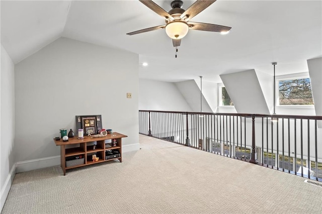 bonus room featuring a ceiling fan, carpet flooring, vaulted ceiling, and baseboards