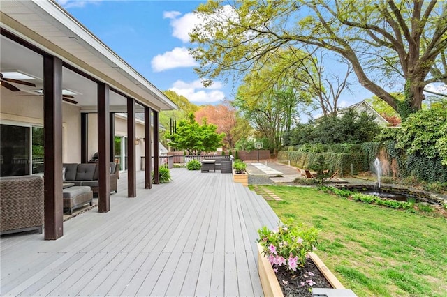 deck featuring an outdoor living space and a ceiling fan