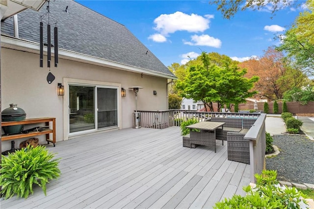 deck with outdoor lounge area and fence