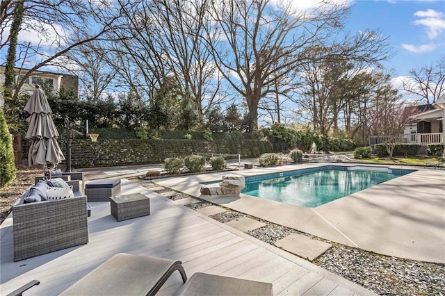 view of pool featuring a patio and fence