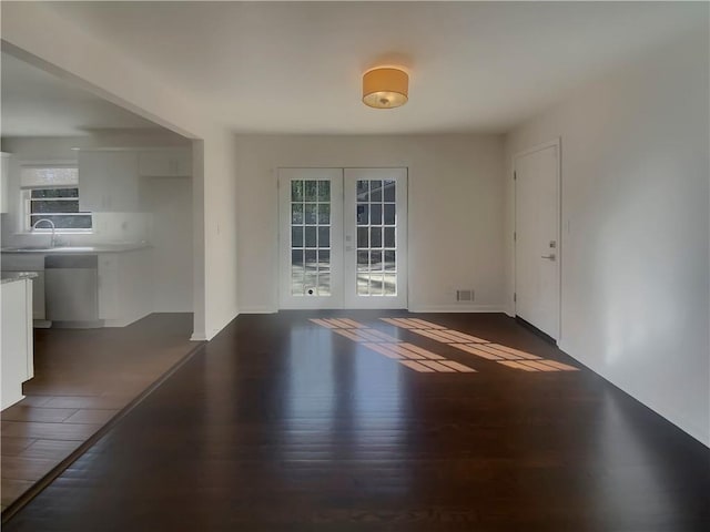 2217 Troutdale Dr, Decatur, GA 30032 - spare room with french doors, dark wood-type flooring, a sink, and visible vents