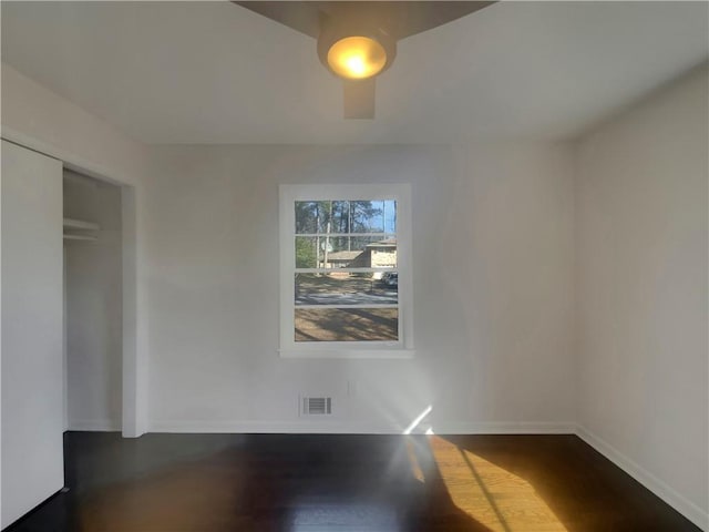 2217 Troutdale Dr, Decatur, GA 30032 - empty room with baseboards, visible vents, and dark wood finished floors