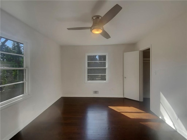 2217 Troutdale Dr, Decatur, GA 30032 - empty room featuring a ceiling fan, visible vents, baseboards, and wood finished floors