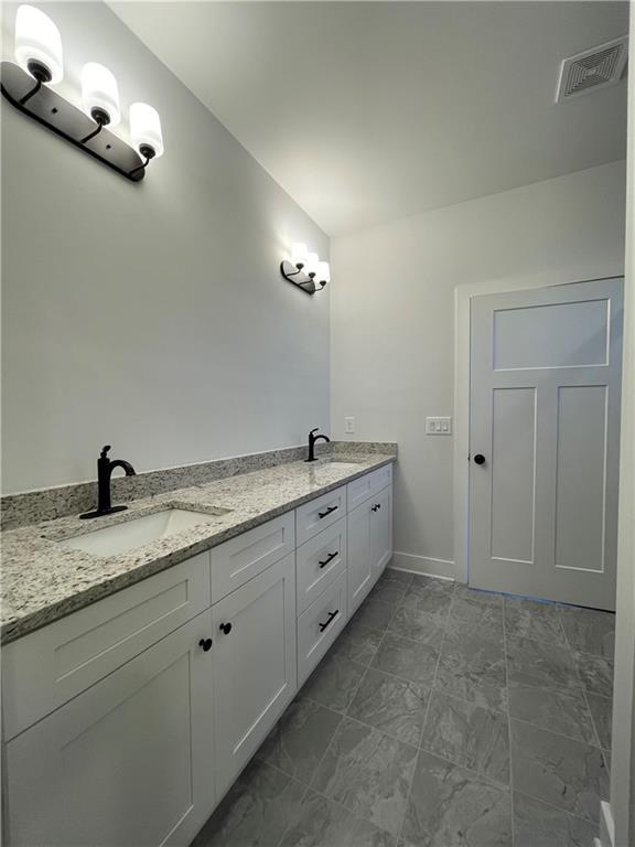 3605 Garden Lakes Pkwy NW, Rome, GA 30165 - full bath featuring double vanity and baseboards