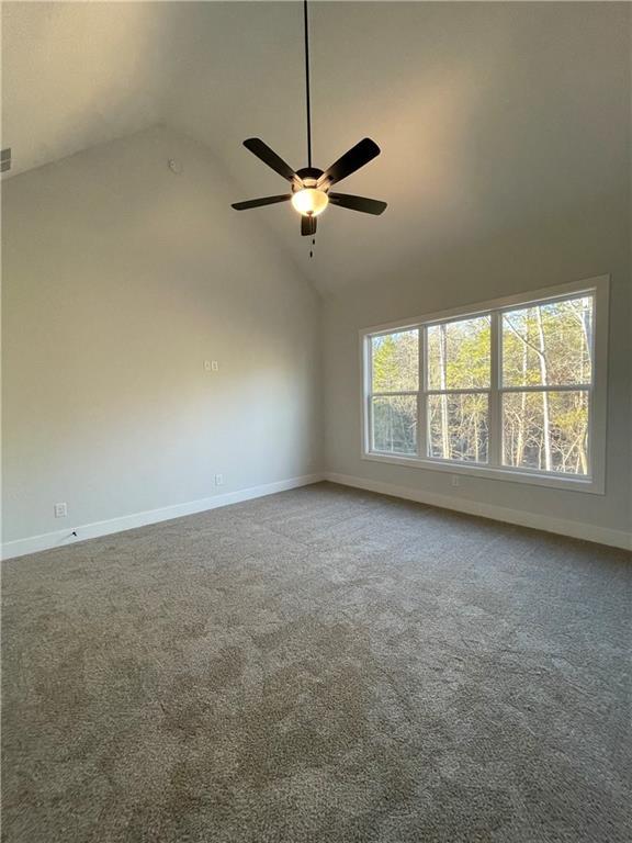 3605 Garden Lakes Pkwy NW, Rome, GA 30165 - empty room with a ceiling fan, baseboards, carpet flooring, and high vaulted ceiling