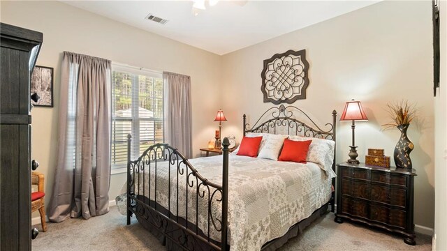 bedroom featuring ceiling fan and light colored carpet