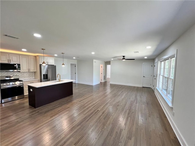kitchen featuring appliances with stainless steel finishes, light countertops, visible vents, and recessed lighting