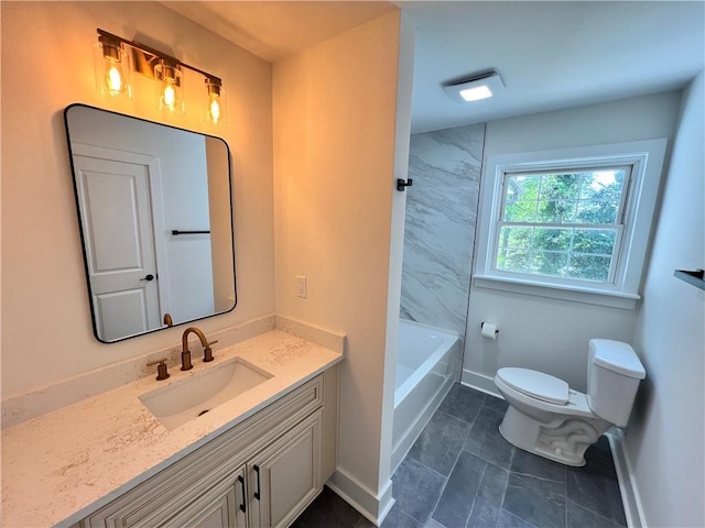 full bathroom with toilet, vanity, and baseboards