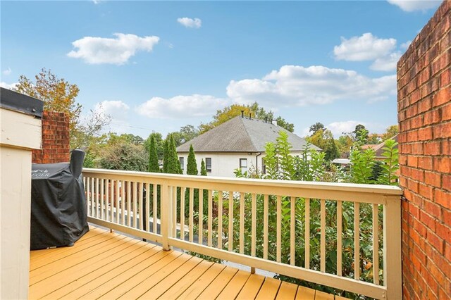 wooden deck with grilling area