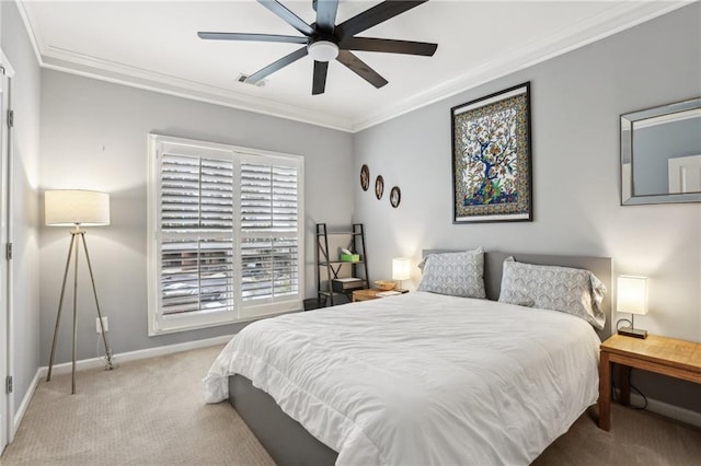 bedroom featuring light carpet, crown molding, and ceiling fan