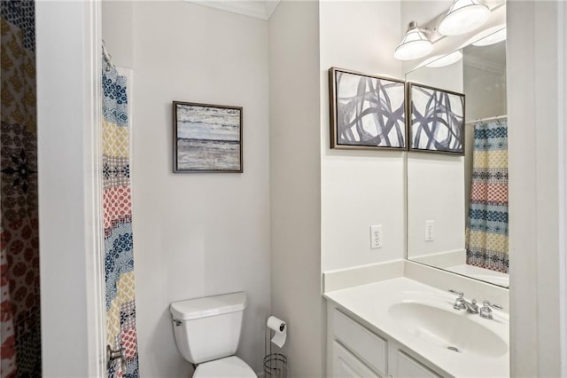 bathroom featuring toilet and vanity