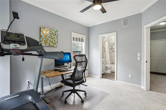 carpeted home office with ornamental molding and ceiling fan