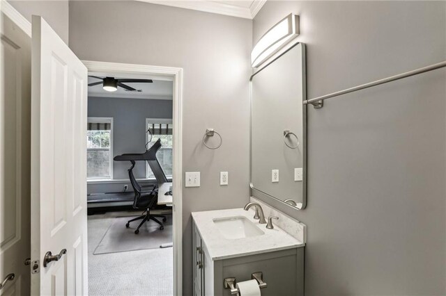 bathroom featuring vanity, ornamental molding, and ceiling fan