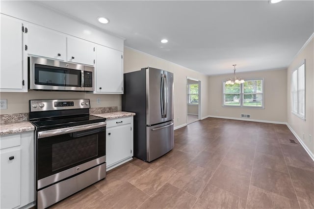 156 Ridgeway St, Winder, GA 30680 - kitchen featuring appliances with stainless steel finishes, a chandelier, white cabinetry, baseboards, and recessed lighting