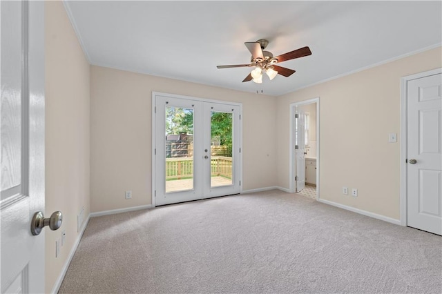 156 Ridgeway St, Winder, GA 30680 - spare room featuring french doors, ceiling fan, carpet flooring, crown molding, and baseboards