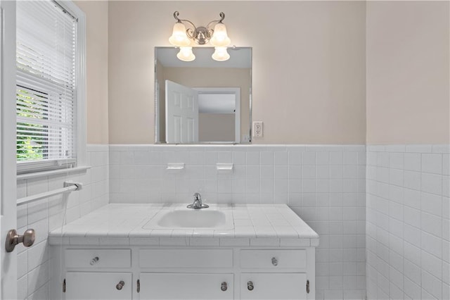 156 Ridgeway St, Winder, GA 30680 - bathroom with vanity, tile walls, a chandelier, and wainscoting