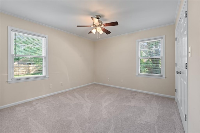 156 Ridgeway St, Winder, GA 30680 - unfurnished room with plenty of natural light, ornamental molding, light carpet, a ceiling fan, and baseboards